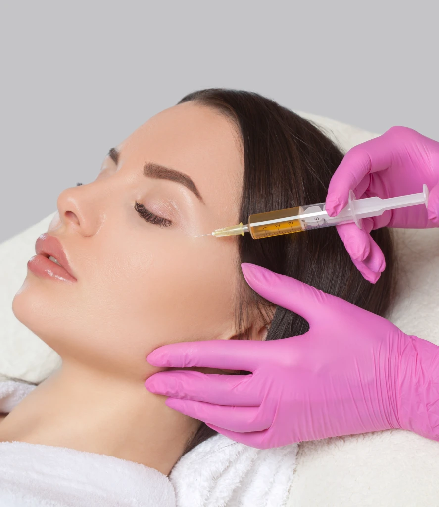 Aesthetic provider applies platelet-rich plasma to a patient's face using a microneedling device during a PRP Facial Treatment in Centennial CO at Refine Med Spa. The procedure promotes collagen production and skin rejuvenation for a radiant complexion.