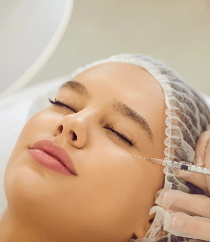 Patient lies comfortably with eyes closed while a clinician administers PRP under eye injections using a fine needle. The treatment at Refine Med Spa in Centennial CO targets dark circles and under-eye hollowness for a refreshed, youthful look.