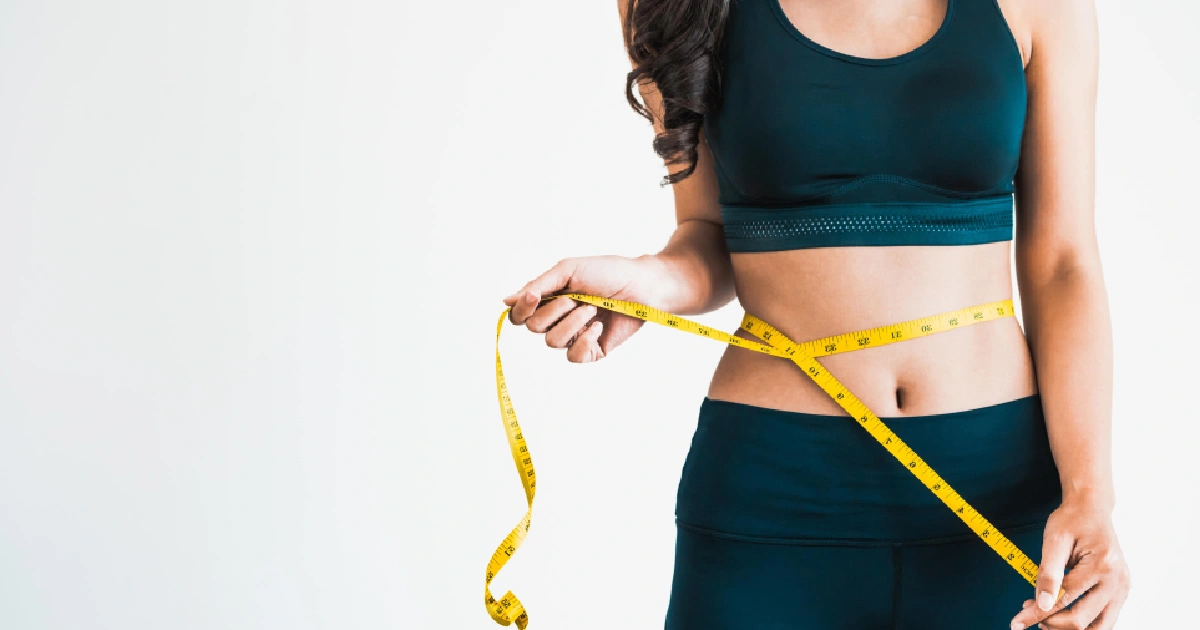 A women measuring body after medical weight loss treatment in Centennial CO